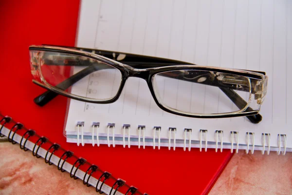 Notebook and glasses — Stock Photo, Image