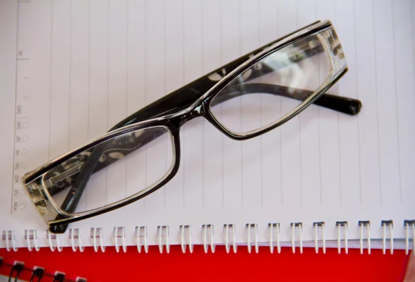 Notebook and glasses — Stock Photo, Image