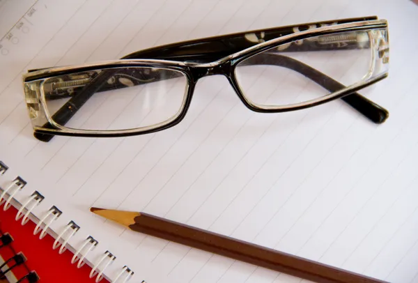 Notebook and glasses — Stock Photo, Image