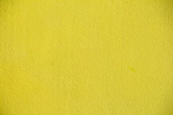 Parede de concreto amarelo como fundo — Fotografia de Stock