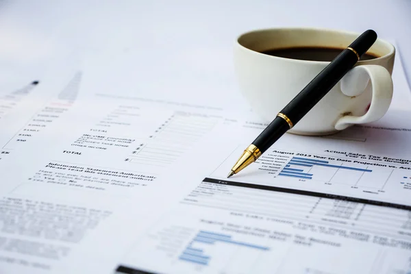 Financial documents with coffee — Stock Photo, Image