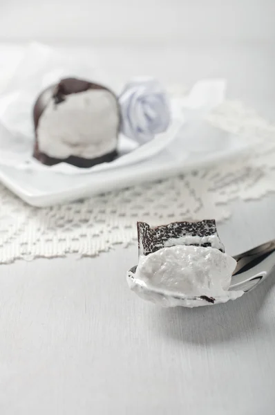 Broken marshmallows in chocolate — Stock Photo, Image