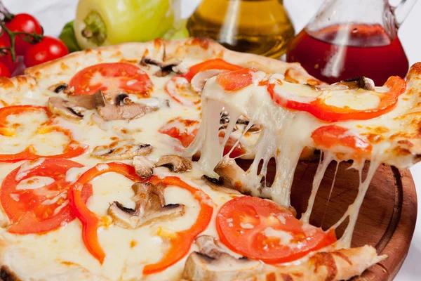 Pizza lifted slice — Stock Photo, Image