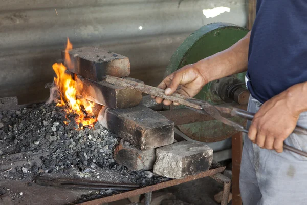 Worker grinding with no safety equipment — Stock Photo, Image