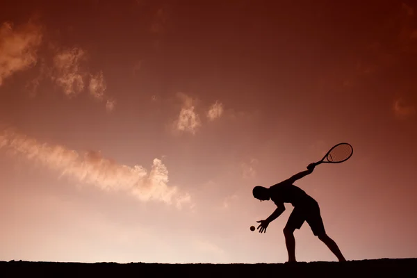 Silhouette eines Tennisspielers — Stockfoto