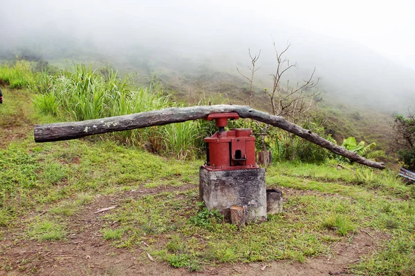 Simple sugar cane press machine  to queezes juice used at small rural settlemen in ecuadorian Andes