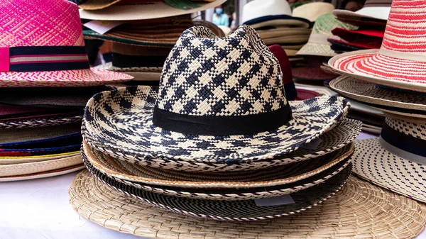 Handmade Panama Hats or Paja Toquilla hat or sombrero at the traditional outdoor market in Cuenca, Ecuador. Popular souvenir from South America