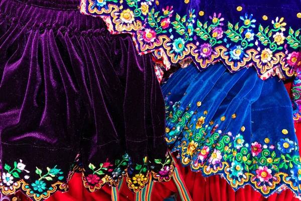 Close up of the skirts with traditional design for Cuenca city and Azuay province of Ecuador. It embroidered with silk thread and adorned with sequins and beads.