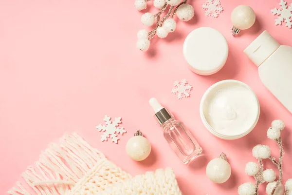 Winter cosmetic, skin care producton pink background. — Stock Photo, Image