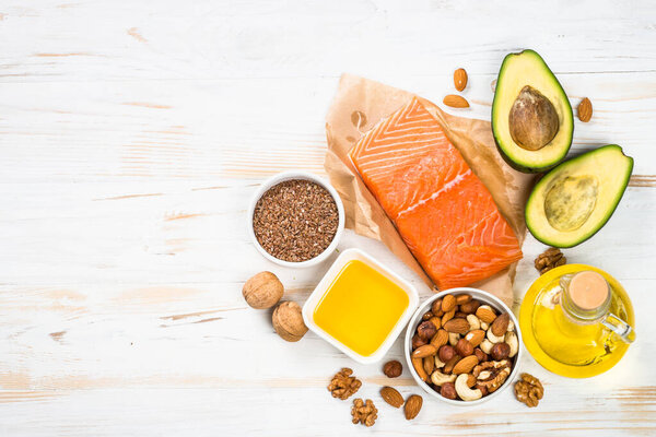 Healthy fats products at white background.