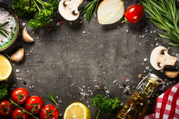 Food cooking background on black kitchen table.