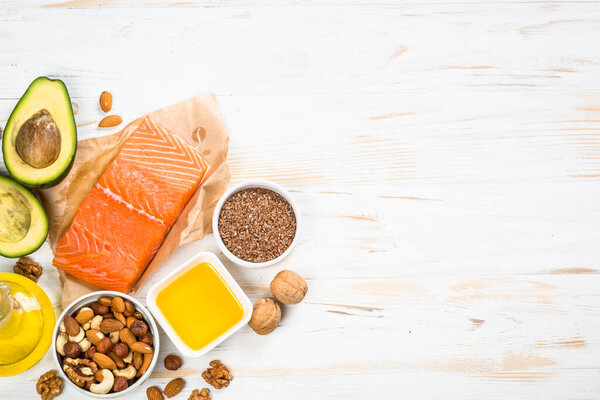 Healthy fats products at white background.