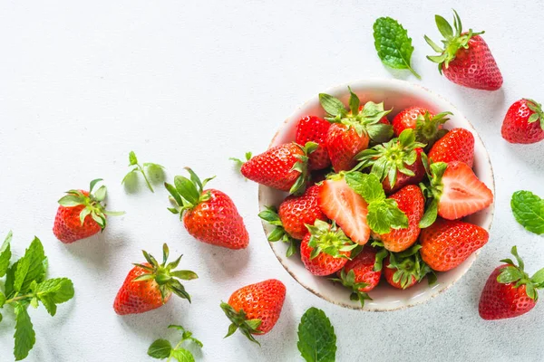Fresh ripe strawberry in the bowl at white table. — Stock Photo, Image