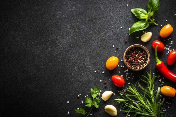 Food cooking background on black stone table. — Stock Photo, Image