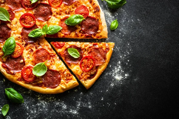 Pizza Salami Cheese Tomatoes Basil Black Table Top View Copy — Stok Foto