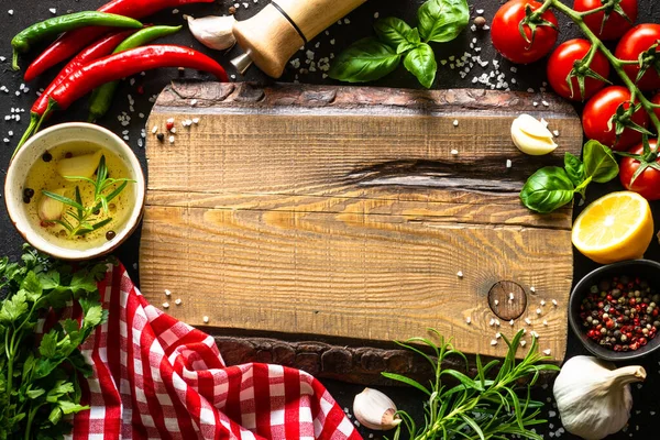 Food Background Oak Cutting Board Spices Vegetables Dark Kitchen Table — 스톡 사진