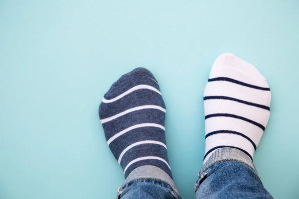 Odd Socks Day Concept Legs Different Socks Blue Background Top — Stock Photo, Image