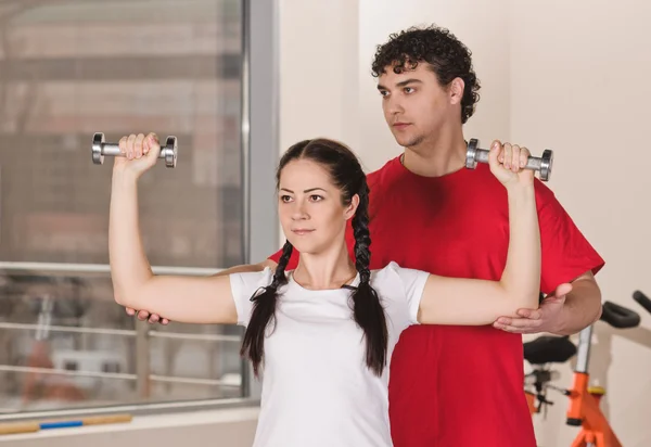 Exercise with dumbbells — Stock Photo, Image