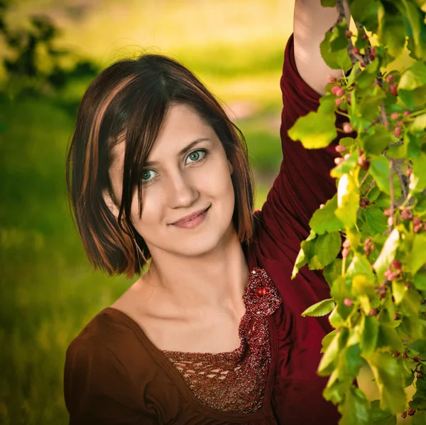 Young woman with twig of mulberry — Stock Photo, Image