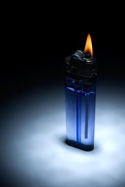 The inexpensive cigarette lighter with flame clipart