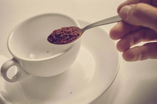 Pouring instant coffee — Stock Photo, Image