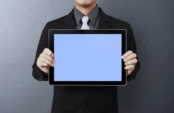 Holding a tablet pc — Stockfoto