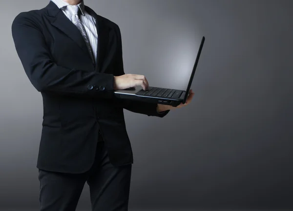 Laptop in his hands — Stock Photo, Image