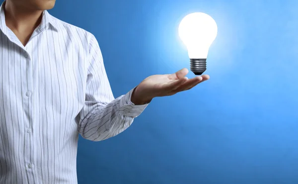 Light bulb, in a hand — Stock Photo, Image