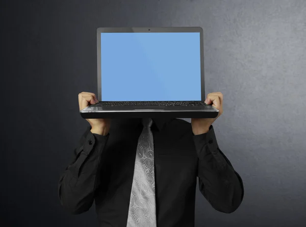 In der Hand einen Laptop — Stockfoto