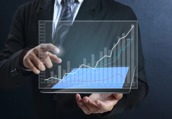 Touch screen graph on tablet in hands — Stock Photo, Image