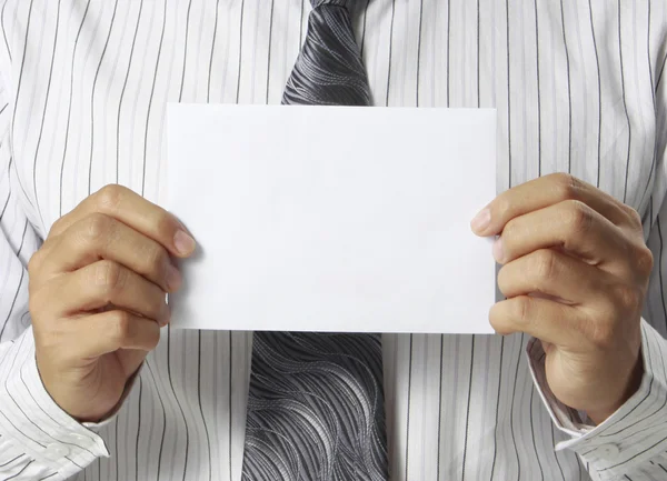 Business man handing blank business card over — Stock Photo, Image