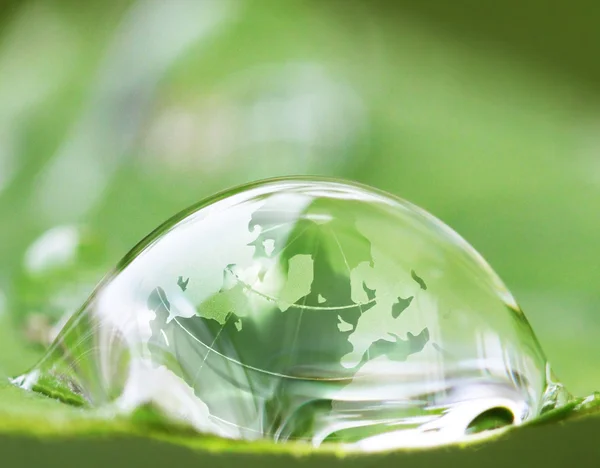 Earth in waterdrop reflection on leaf — Stock Photo, Image