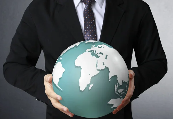 Holding a glowing earth globe in his hands — Stock Photo, Image