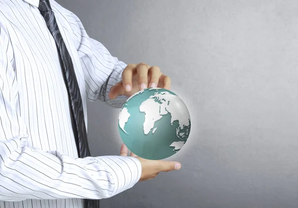 Holding a glowing earth globe in his hands — Stock Photo, Image