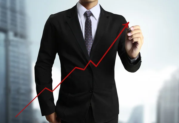 Obchodní muž ruku nakreslený graf — Stock fotografie