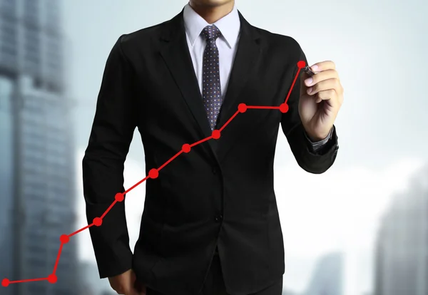 Obchodní muž ruku nakreslený graf — Stock fotografie