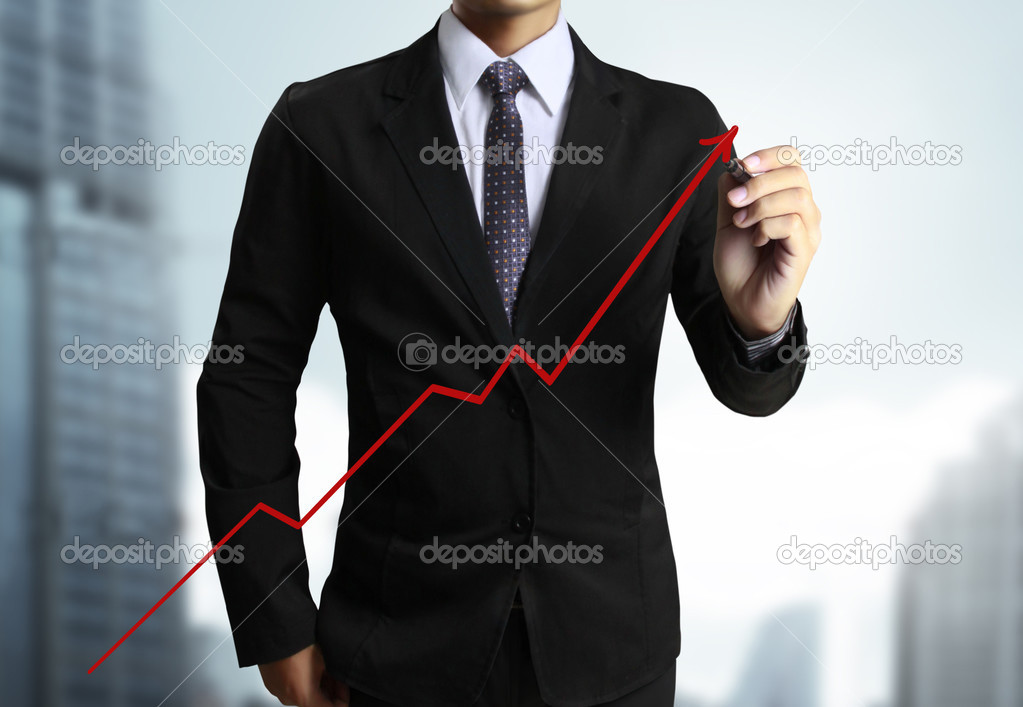 Business man hand drawing graph