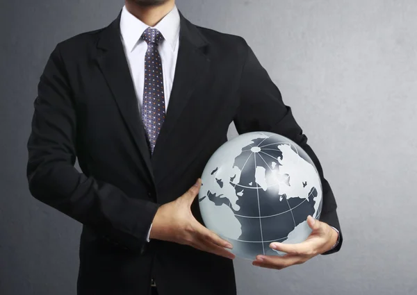 Holding a glowing earth globe in his hand — Stock Photo, Image