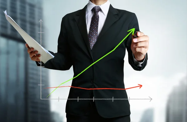 Business man hand drawing graph — Stock Photo, Image