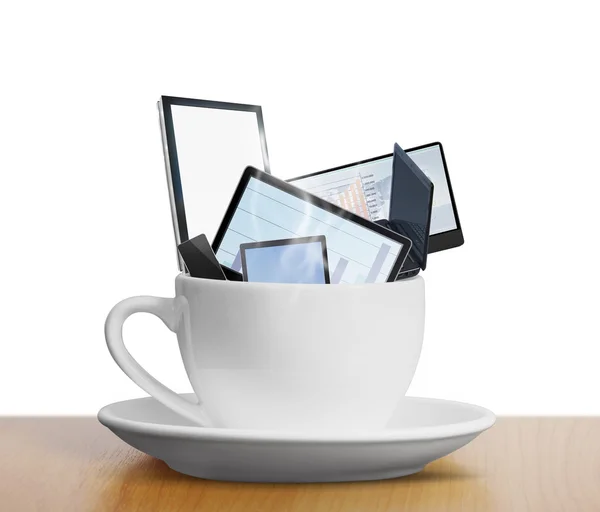 Tablet touch computer gadget in cup of coffee — Stock Photo, Image