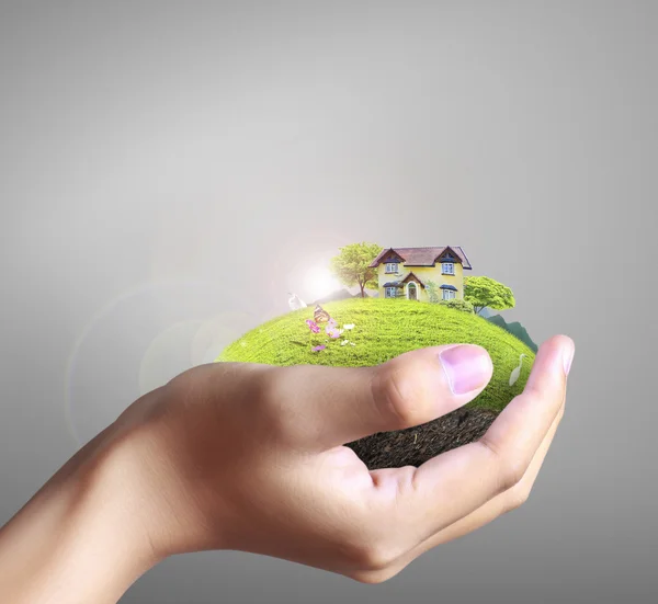 House in human hands — Stock Photo, Image