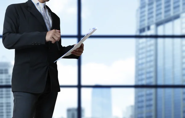 View of businessman reading documents in hand — Stock Photo, Image