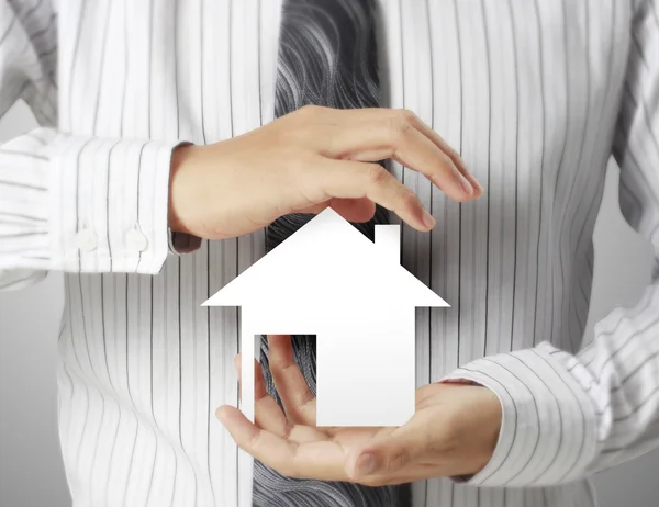 Man holding house — Stock Photo, Image