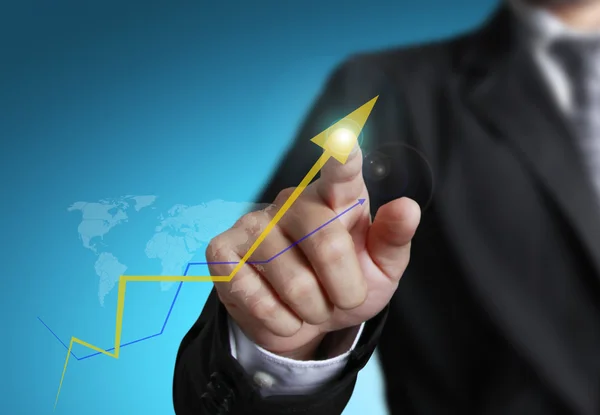 Business man pointing at growth graph — Stock Photo, Image