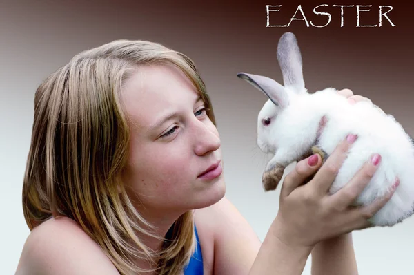 Easter rabbit in hands of the young girl — Stock Photo, Image