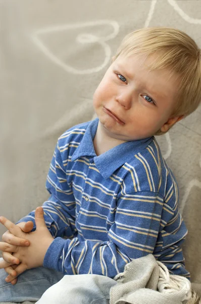 Porträtt av ett gråtande barn Stockbild