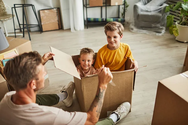 Father and Sons Playing with Boxes — Stock Photo, Image