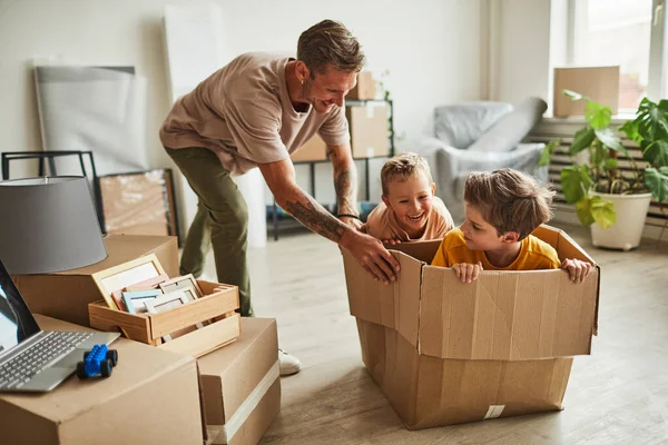 Two Boys Playing with Dad in New House — Stock Photo, Image