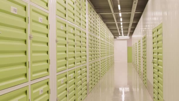 Tracking Right Hallway Self Storage Facility Multiple Rows Green Colored — Stock Video