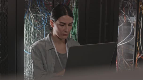 Chest Dark Haired Caucasian Female Engineer Leaning Back Racks Server — Stock Video